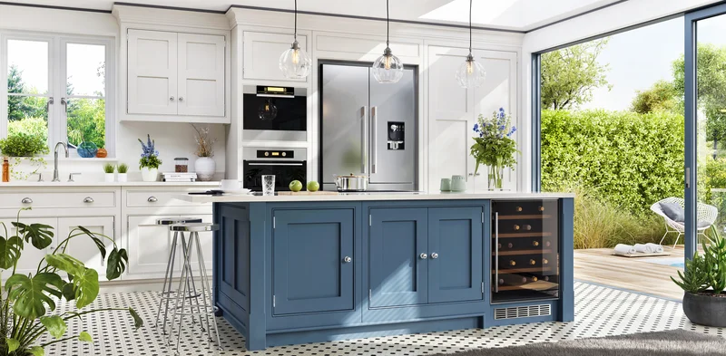 Modern kitchen remodel featuring a large blue island and white cabinets.