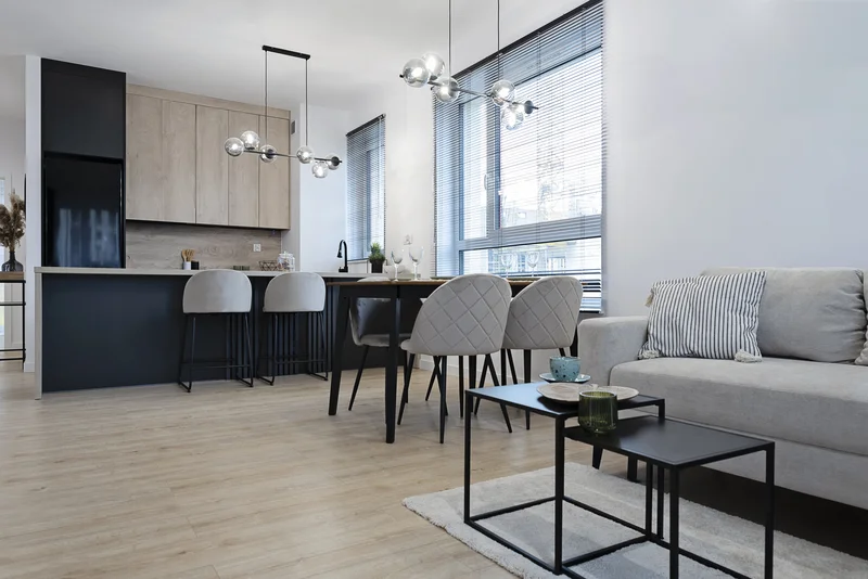 Contemporary open-concept interior painting in gray and white tones.