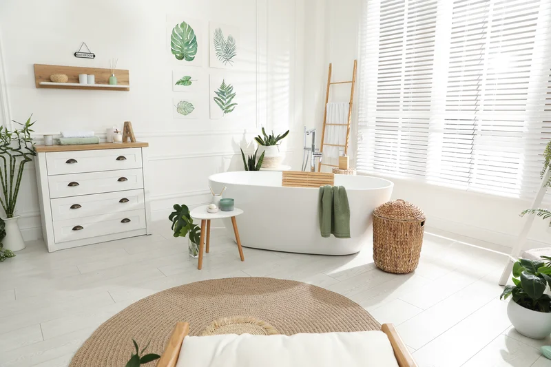 Bright bohemian bathroom remodel with white freestanding bathtub. Bright bohemian bathroom remodel with white freestanding bathtub.